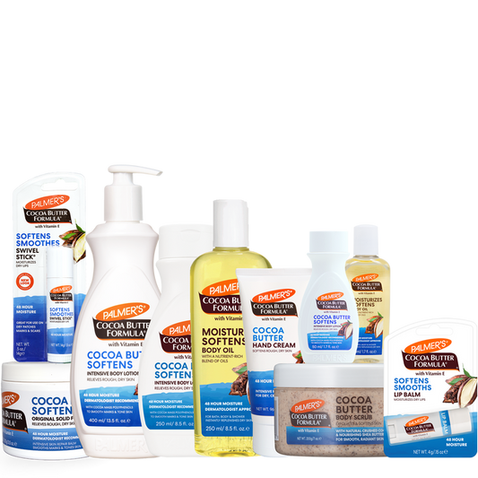 A collection of Palmie's Cocoa Butter Formula body care products, including hand cream, body lotion, hand cream, body oil, hand cream, lip balm, and a jar of cocoa butter body butter, arranged together on a plain white background.