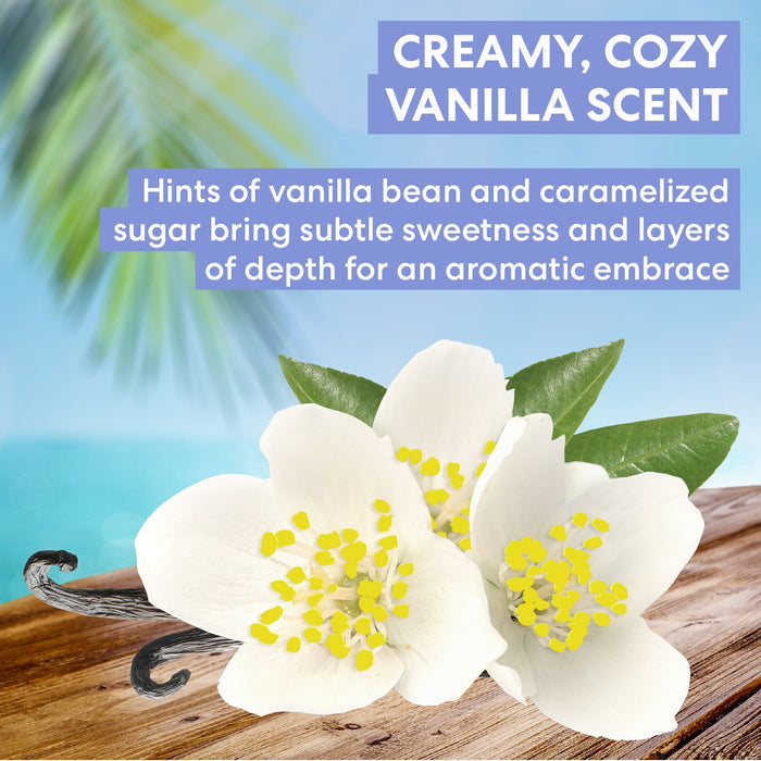 Vanilla flowers with a vanilla bean on a wooden surface, set against a blurred beach background.