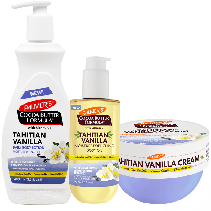 A Palmer's Cocoa Butter Formula body care set featuring a large white pump bottle of Tahitian Vanilla Daily Body Lotion, a yellow pump bottle of Tahitian Vanilla Moisture Drenching Body Oil, and a lavender-blue tub of Tahitian Vanilla Cream, all on a white background.