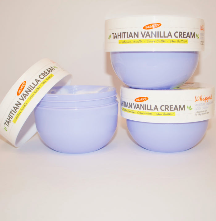 Three containers of Tahitian Vanilla Cream on a white background