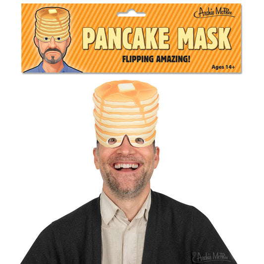 A man wearing the Pancake Mask made from EVA foam, paired with glasses, is smiling at the camera, showcasing a distinctive adult costume style. Packaging displayed above.