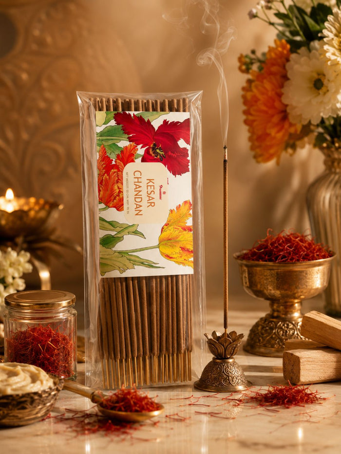 Agarbatti incense sticks pack with scattered fragrant powder and small metal incense holder