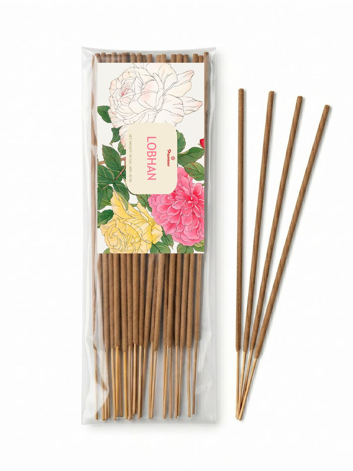 Traditional incense sticks, five sticks visible in a clear box with floral label