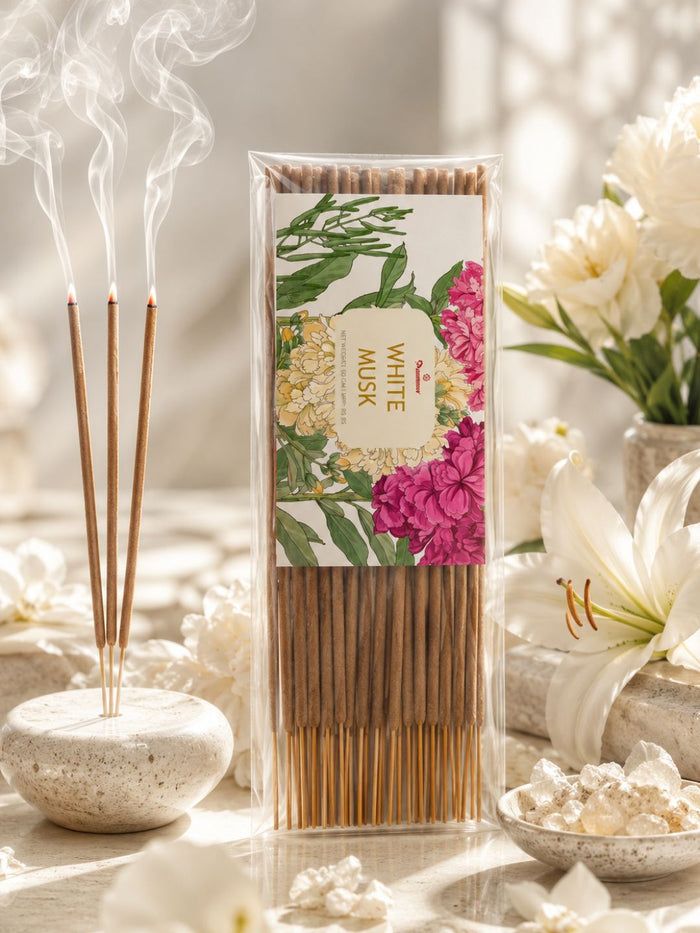 White musk agarbatti incense sticks in clear box with floral label, bundled wooden sticks