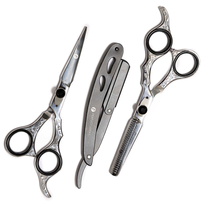 Three silver and black barber tools are arranged on a white background: straight scissors, a folding razor, and thinning scissors.