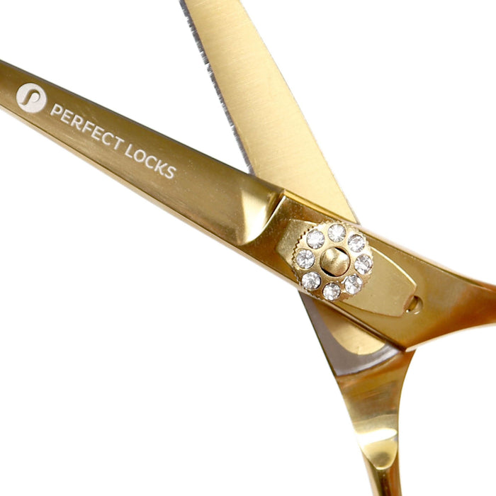 Gold professional hair cutting scissors with "Perfect Locks" engraved on the blade and a jeweled screw hinge, on a white background.