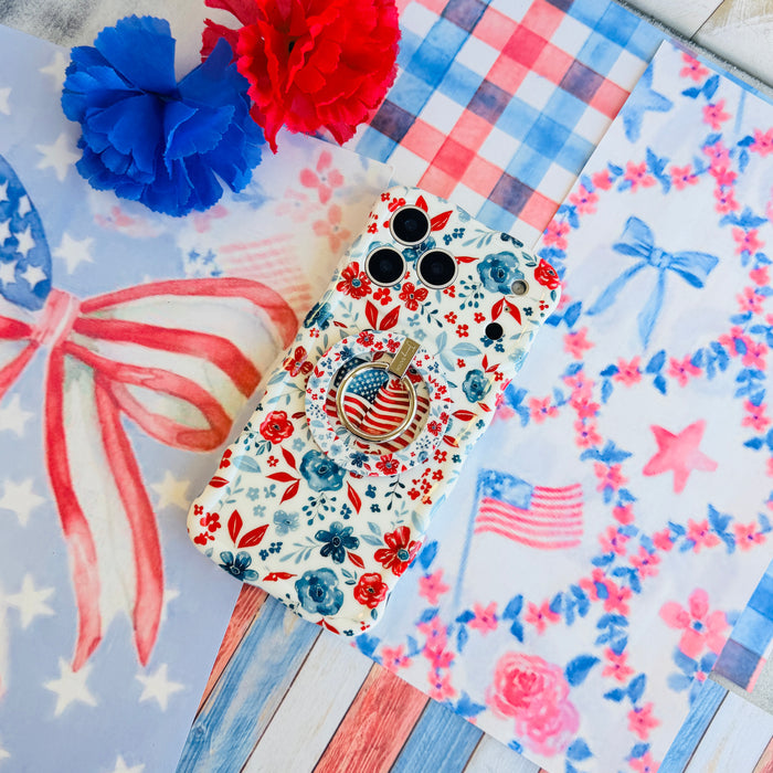 Trendy wavy iPhone case featuring an American flag illustration surrounded by a red and blue watercolor floral pattern with a high-gloss finish.