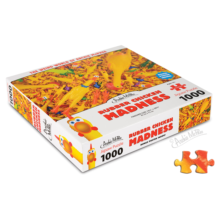 Box of a Rubber Chicken Madness Puzzle, a 1000-piece jigsaw featuring a quirky rubber chickens design with a detailed puzzle piece nearby.