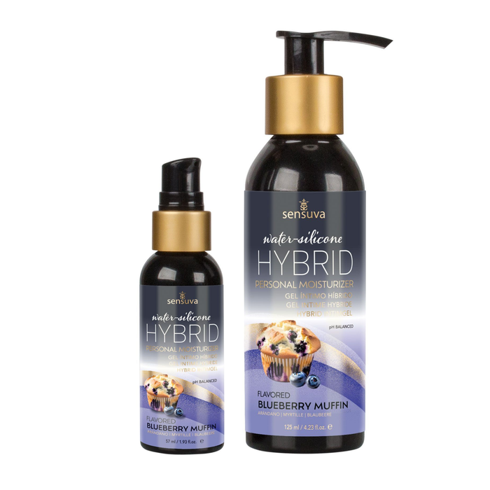 Two dark bottles of Sensuva Hybrid personal moisturizer stand side-by-side against a white background, with the smaller bottle on the left and the larger bottle on the right. Both feature gold accents and a blueberry muffin graphic on their purple-shaded labels.