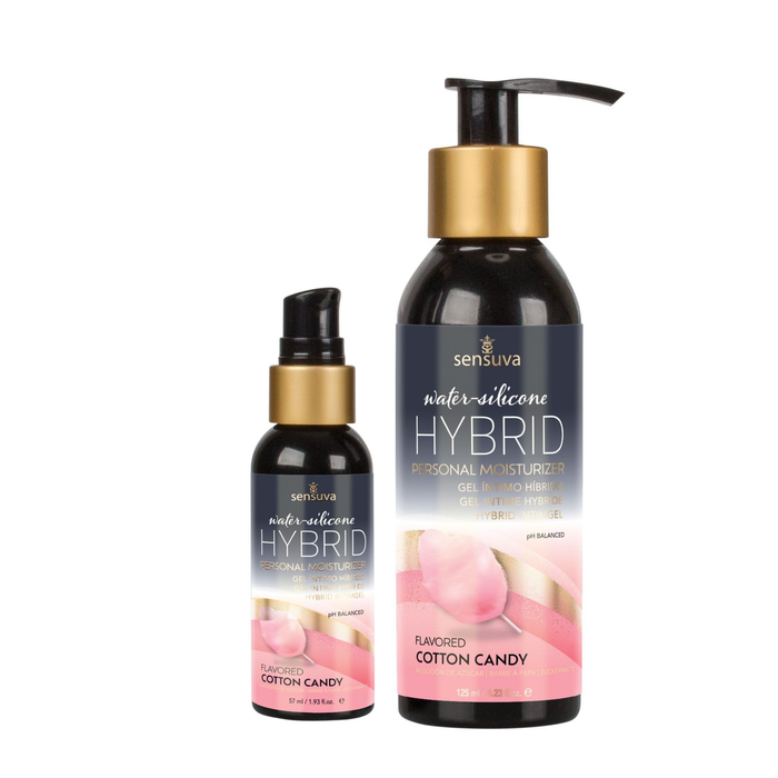 Two dark bottles of Sensuva Hybrid personal moisturizer stand side-by-side against a white background, with the smaller bottle on the left and the larger bottle on the right. Both feature gold accents and a pink cotton candy graphic on their labels.