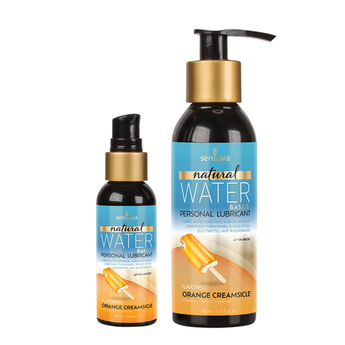 Two dark bottles of Sensuva Natural Water Based personal lubricant stand side-by-side against a white background. Both feature vibrant blue labels with gold accents and a graphic of an orange creamsicle popsicle.