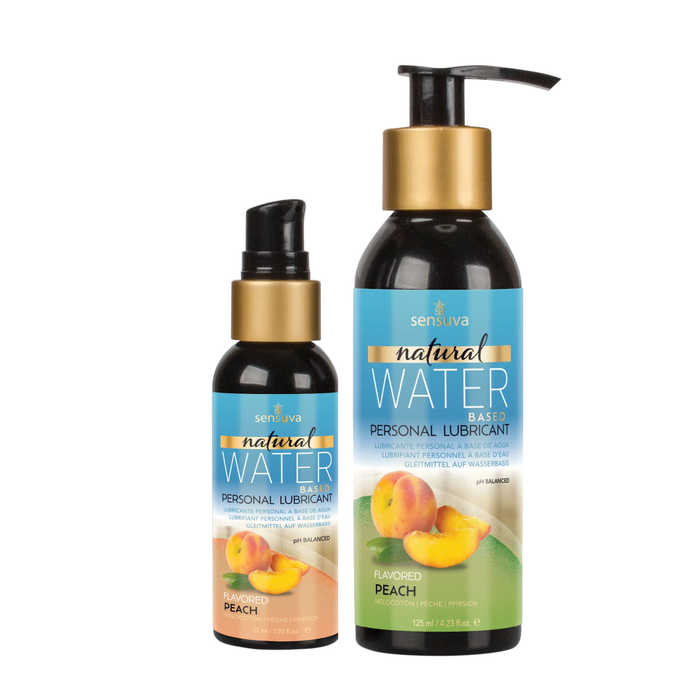 Two dark bottles of Sensuva Natural Water Based personal lubricant are shown side-by-side against a white background. Both feature bright blue labels with gold accents and a graphic of a fresh peach and peach slices.