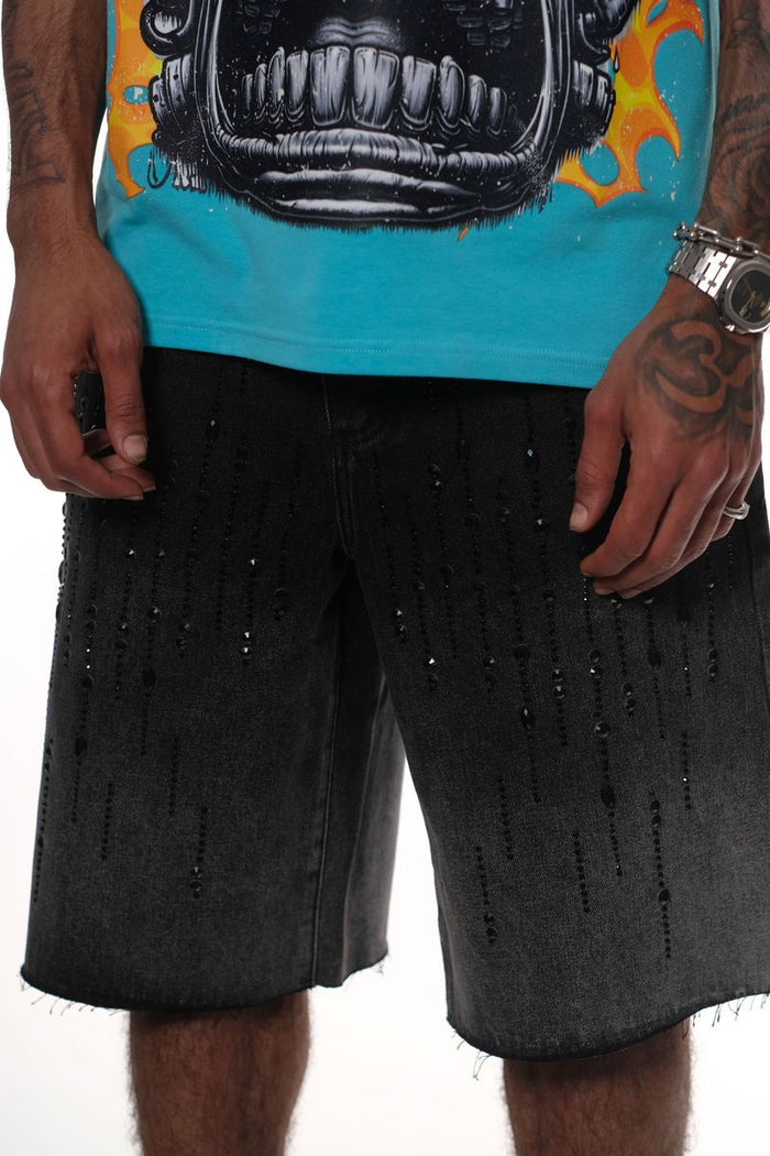 Close-up of Vicious Black Denim Shorts featuring sparkling rhinestone details and distressed style