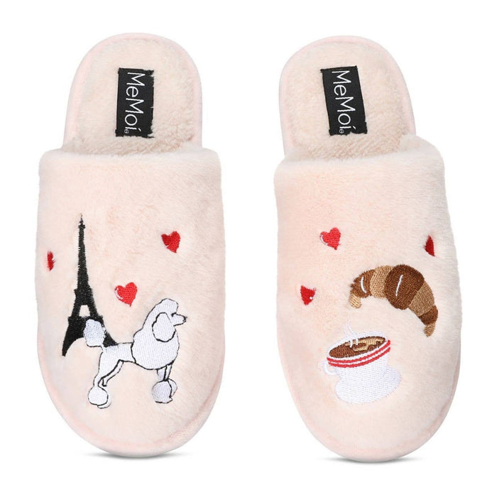 Pair of cream slippers with Eiffel Tower, poodle, croissant, and coffee cup designs on a white background.
