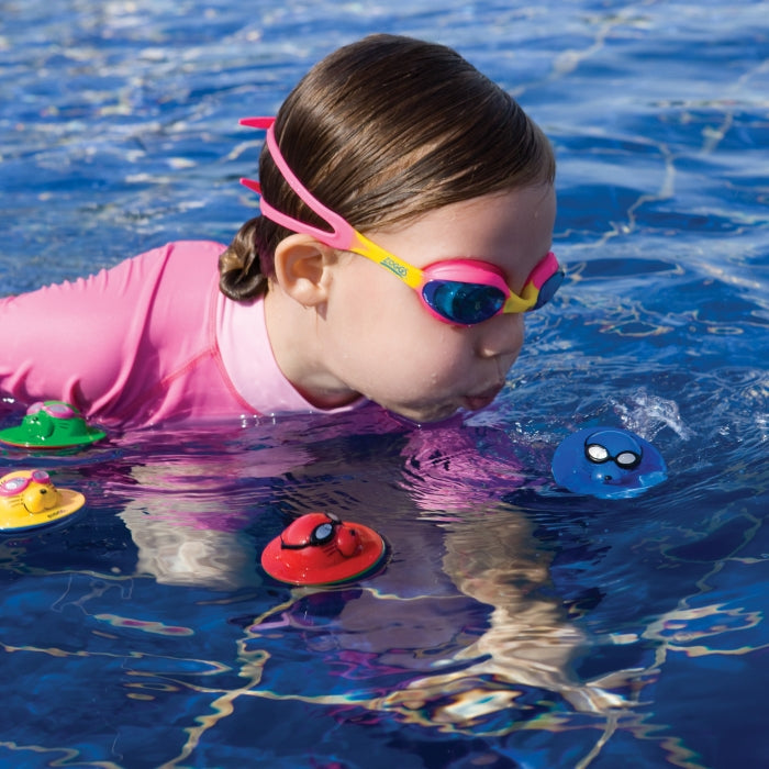 Cute pink Zoggs Seal Flips swim cap with yellow and blue accents for kids